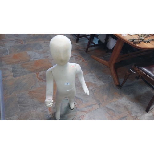 38 - Vintage child mannequin, cream fabric-covered body on a clear glass base.