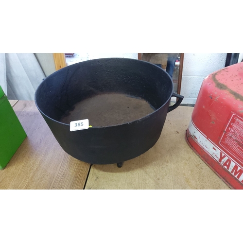 385 - Cast iron cauldron with three short legs and side handles. Approximate diameter: 30 cm (11.8 inches)... 