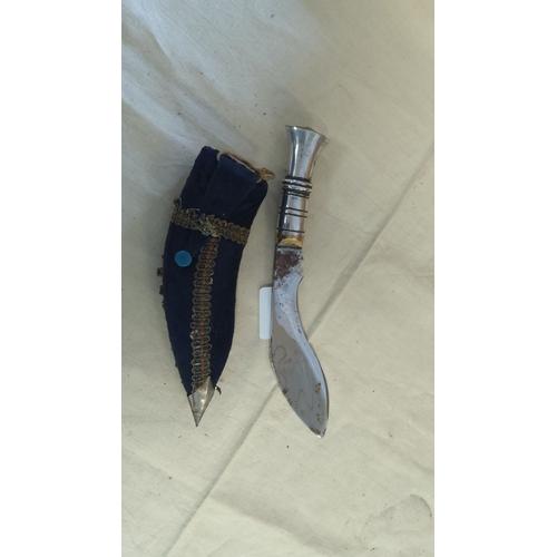 4 - Antique ornamental knife with curved blade and metal handle. Includes a richly embellished fabric sh... 