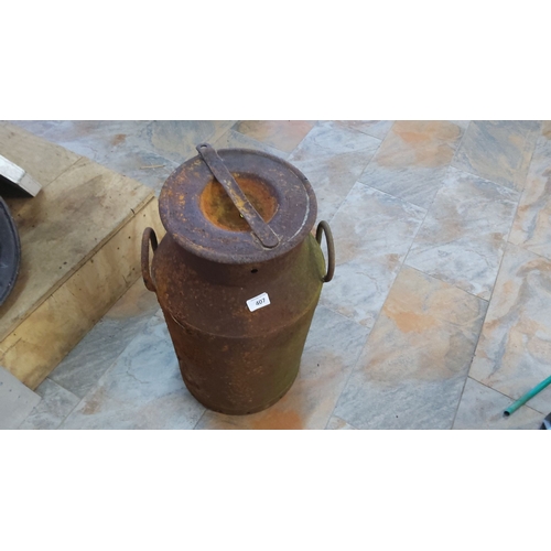 407 - Vintage metal milk can, featuring a sturdy handle and a hinged lid, approximately mid-20th century.