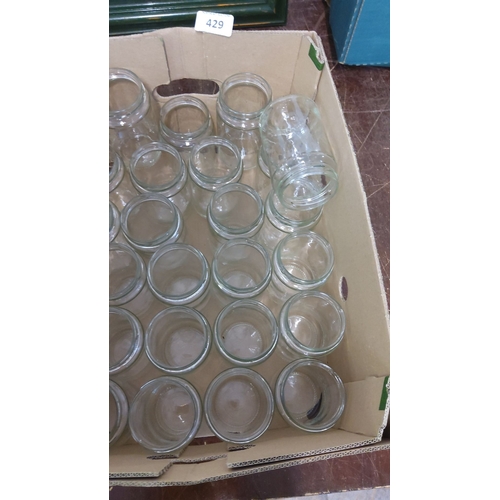 429 - Collection of 24 transparent glass jars