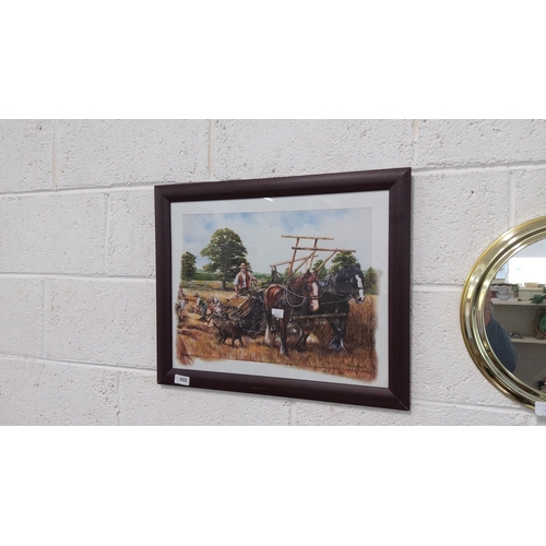 432 - Framed print depicting a pastoral scene with horses ploughing a field, set in a dark wooden frame. T... 