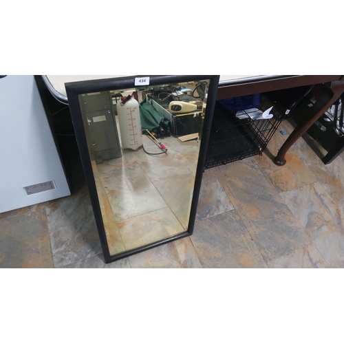 434 - Rectangular wall mirror with a black wooden frame. Dimensions roughly 24