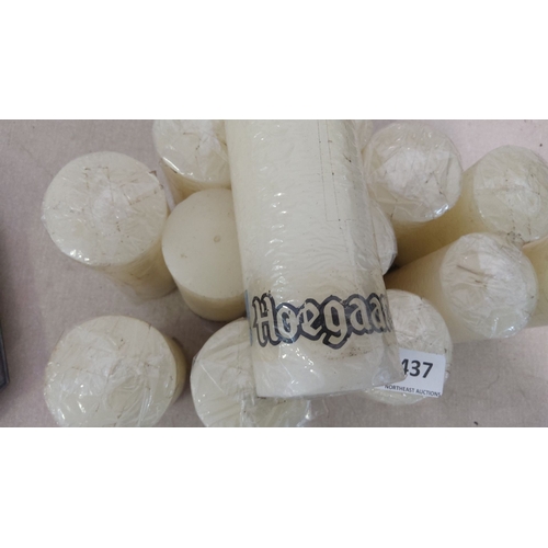 437 - Set of twelve white Hoegaarden pillar candles, individually wrapped.