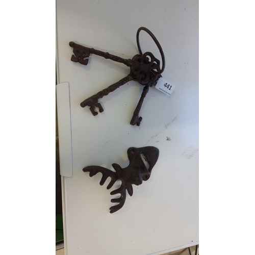 441 - Collection of antique iron skeleton keys with ornate designs. Included is a moose head bottle opener... 