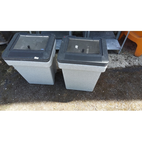 446 - Pair of Rubbermaid outdoor rectangular trash containers with secure black lids. Made from durable, g... 