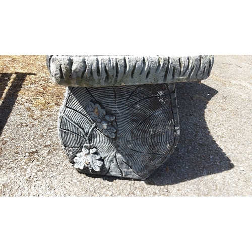 457 - Concrete bench with intricate wood grain texture and leaf pattern design on the legs.