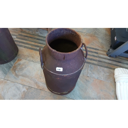 471 - Vintage metal milk churn with handles, showing signs of rust and age. Early 20th-century dairy farmi... 