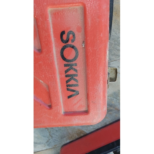 487 - Sokkia surveying pipe laser in carrying case with accessories.