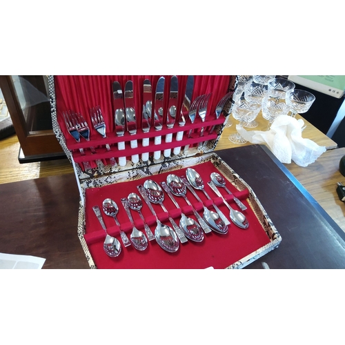 506 - Complete set of stainless steel cutlery in ornate presentation case. Includes knives, forks, teaspoo... 