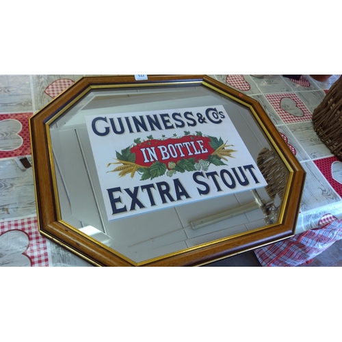 512 - Replica Framed Guinness & Co. Extra Stout mirror, octagonal shape with wooden frame. Features classi... 