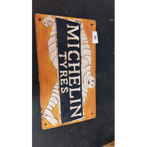 58 - Vintage Michelin Tyres cast iron sign featuring the iconic Bibendum, set against a bold yellow and b... 