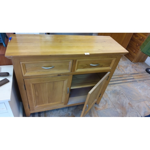 85 - This is a wooden sideboard featuring two drawers and two cabinet doors, fitted with modern metal han... 