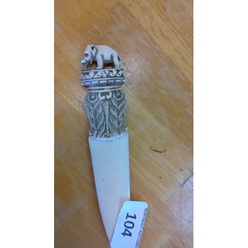 104 - Hand-carved letter opener featuring an intricately detailed elephant atop the handle, adorned with d... 