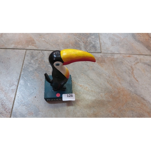 126 - Vintage Guinness toucan figurine. The figurine features the iconic bird with a vibrant yellow and re... 