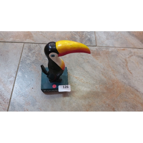 126 - Vintage Guinness toucan figurine. The figurine features the iconic bird with a vibrant yellow and re... 