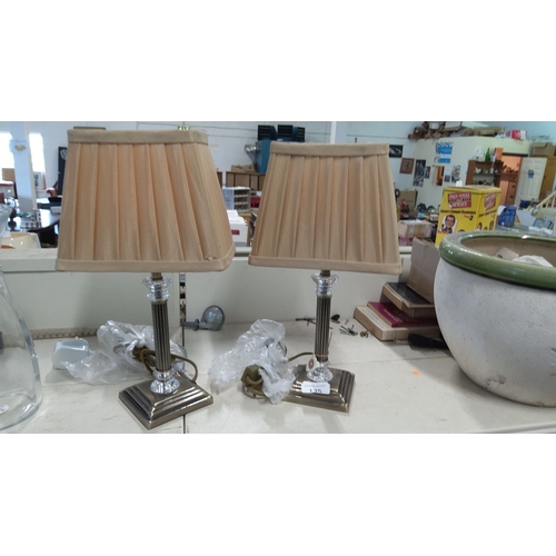 135 - Pair of table lamps with beige pleated shades and ribbed metal bases adorned with crystal accents.