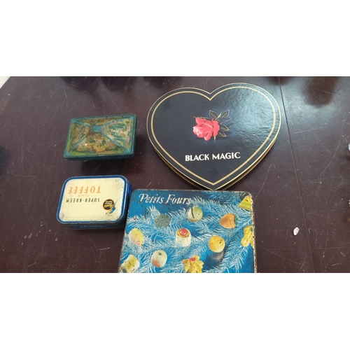 180 - Collection of four vintage tin boxes. These boxes include a heart-shaped Black Magic box, Super-Kree... 