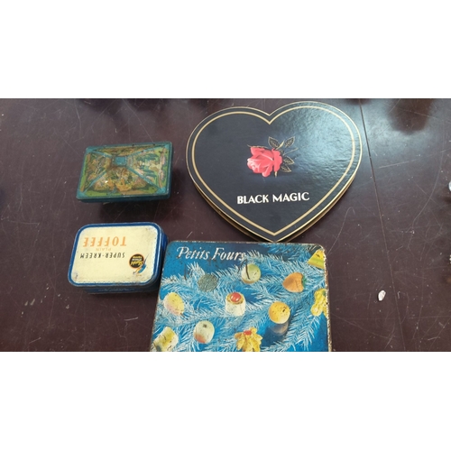 180 - Collection of four vintage tin boxes. These boxes include a heart-shaped Black Magic box, Super-Kree... 