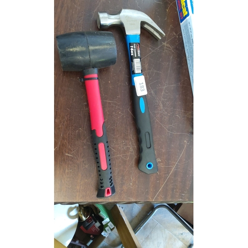 183 - Rubber mallet with red and black handle. 16oz drop-forged claw hammer with blue and black handle.