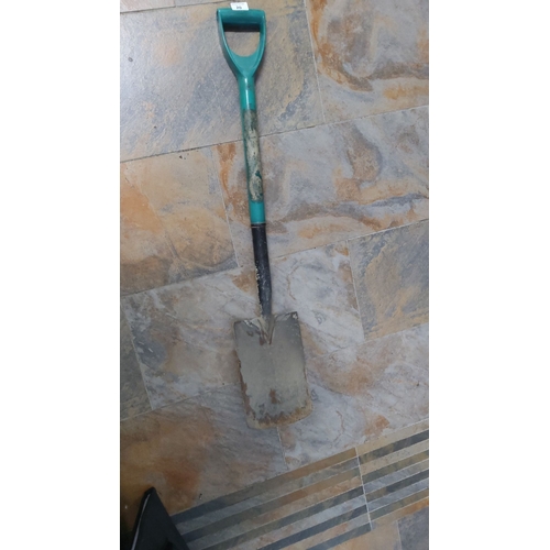20 - Standard garden spade with teal handle and black shaft. Measures approximately 3 feet in length.