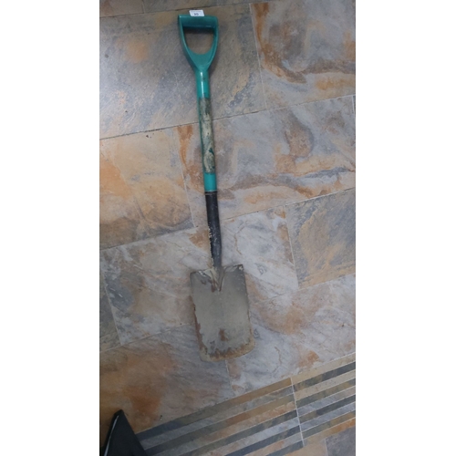 20 - Standard garden spade with teal handle and black shaft. Measures approximately 3 feet in length.