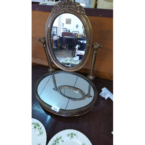 220 - Antique bronze vanity mirror with ornate detailing, featuring a swiveling oval mirror and circular m... 