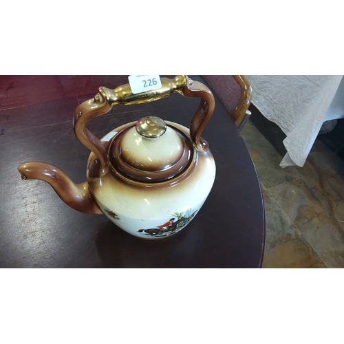 226 - Stoke-on-Trent large pottery teapot. Features a hunter and horse motif and is made in England. The t... 