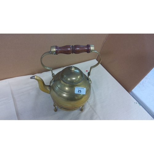 25 - Victorian brass kettle with a wooden handle, includes a matching brass trivet.
