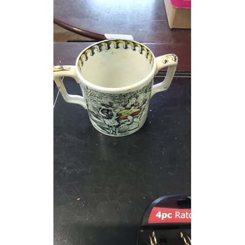 266 - Porcelain Imperial Pint mug is vintage and features colorful illustrations of children and dogs. The... 