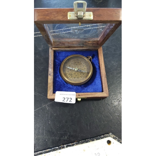 272 - Brass pocket compass by T. Harris & Sons, London, housed in a wooden presentation box with interior ... 