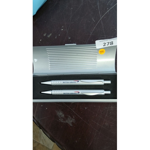 278 - Set of two British Airways branded silver pens in a matching metallic case, featuring the airline's ... 