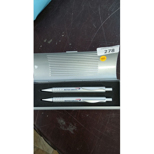 278 - Set of two British Airways branded silver pens in a matching metallic case, featuring the airline's ... 