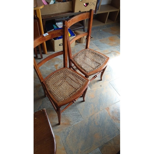 284 - Pair of French Provincial oak chairs with caned seats.