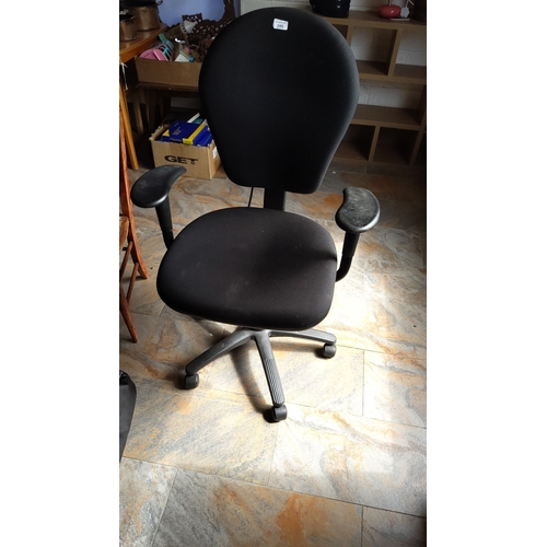 285 - Adjustable swivel office chair with black fabric upholstery. Features ergonomic backrest and armrest... 