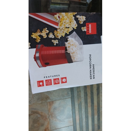 29 - Sensio Home American Popcorn Maker with a vibrant red design and easy-to-use functionality.