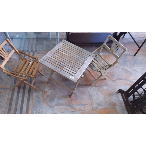 292 - Set of two wooden folding chairs and matching wooden slat table.(suitable for children)