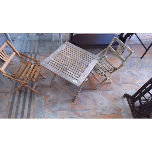 292 - Set of two wooden folding chairs and matching wooden slat table.(suitable for children)