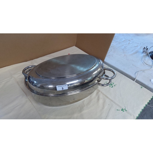 3 - Vintage stainless steel roasting pan with lid and removable rack, featuring dual handle design.