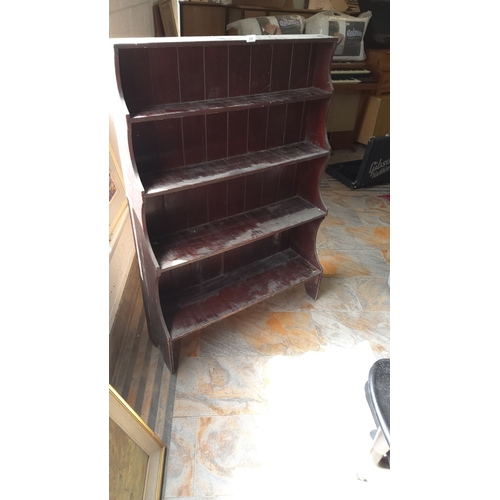 304 - Dark wood bookshelf with three spacious shelves, featuring serpentine edges. Origin or period unspec... 