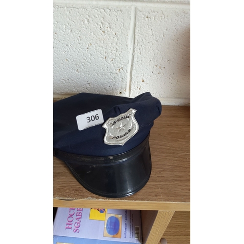 306 - Police cap featuring a 