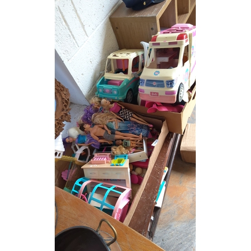 307 - Collection of various Barbie dolls and accessories, including two Barbie vehicles and assorted dollh... 