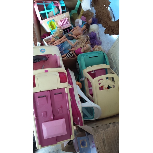 307 - Collection of various Barbie dolls and accessories, including two Barbie vehicles and assorted dollh... 