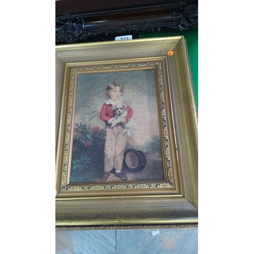 313 - Oil painting of a young child holding a small dog. The piece is framed in an ornate gold frame, refl... 