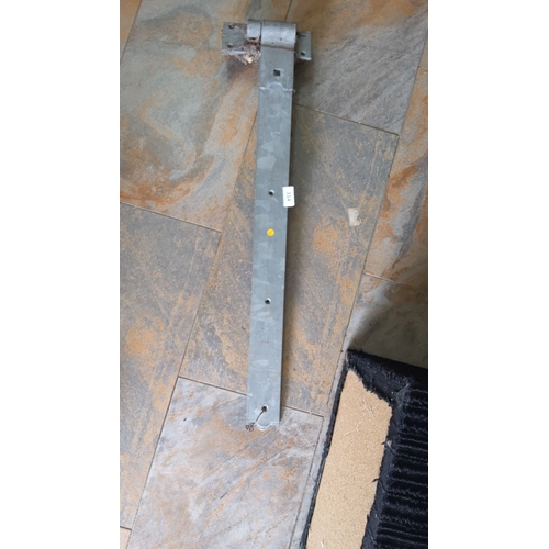 314 - Galvanized steel hinge bracket with multiple mounting holes x 2. Dimensions: approximately 24 inches... 