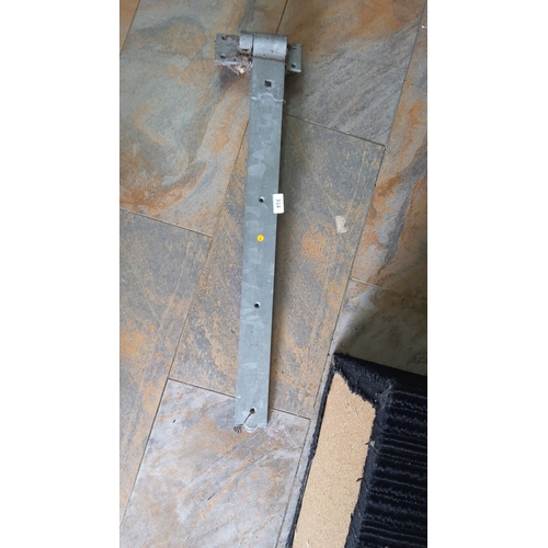 314 - Galvanized steel hinge bracket with multiple mounting holes x 2. Dimensions: approximately 24 inches... 