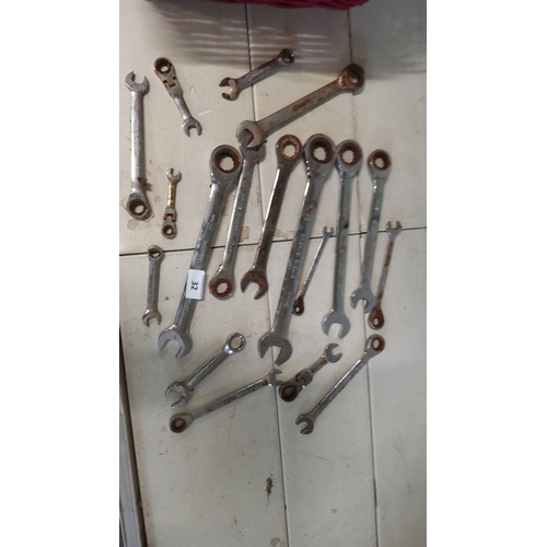 32 - Assorted metal wrenches, various sizes and types, including open-end and ratcheting wrenches.