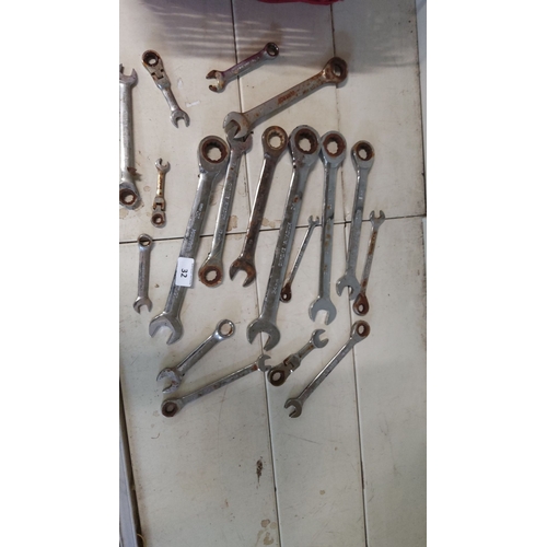 32 - Assorted metal wrenches, various sizes and types, including open-end and ratcheting wrenches.