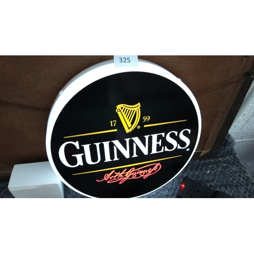 325 - Illuminated Guinness sign featuring iconic branding with harp logo and signature. Measures approxima... 