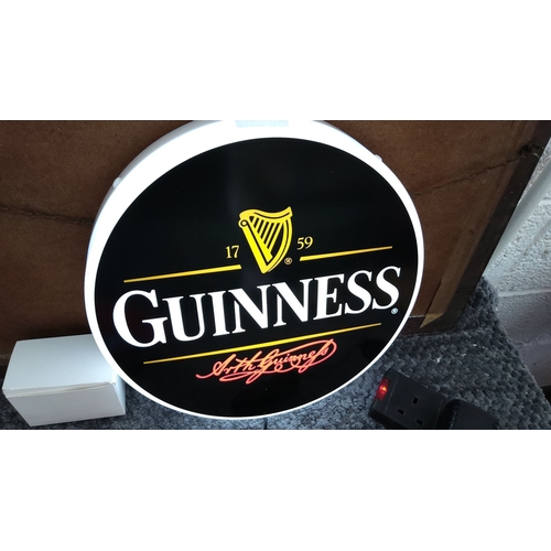 325 - Illuminated Guinness sign featuring iconic branding with harp logo and signature. Measures approxima... 